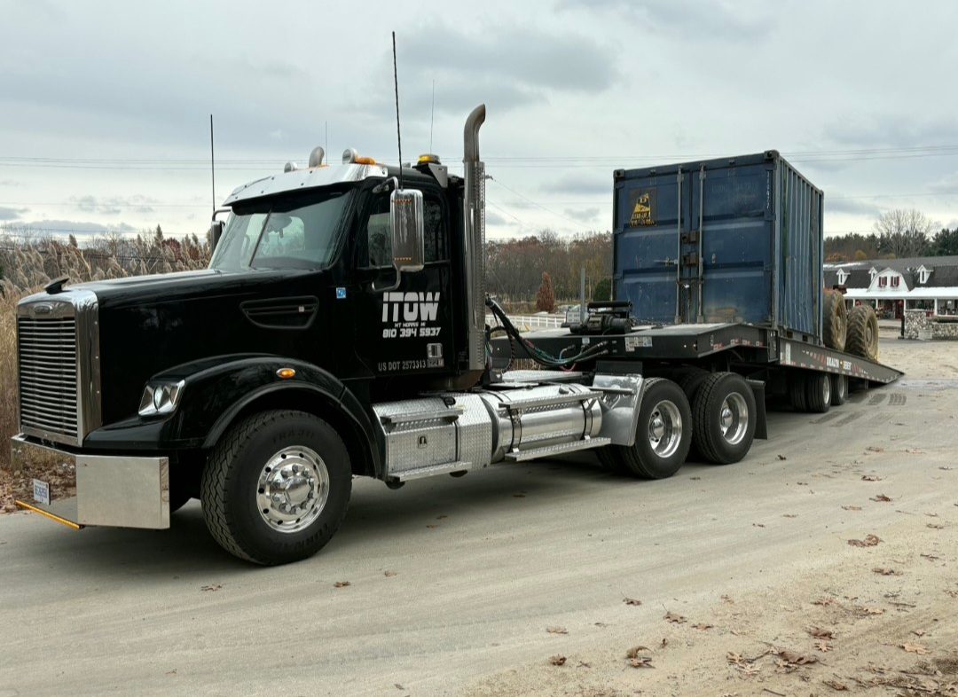 Freightliner hauling shipping container