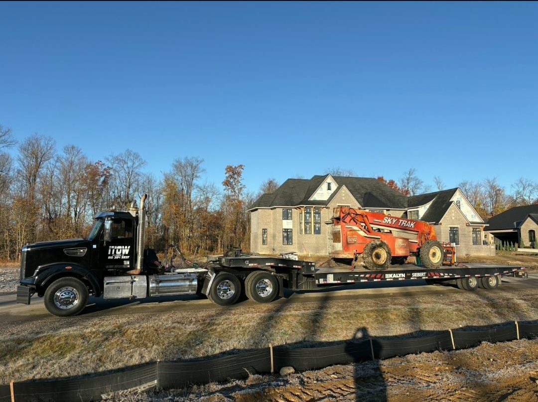 SkyTrak on trailer at subdivision job site