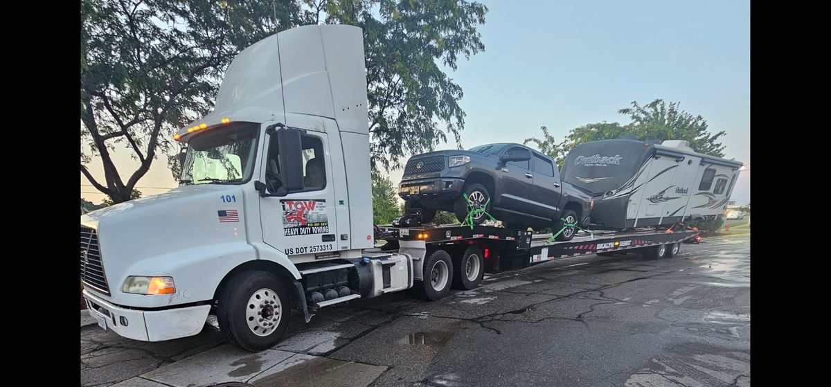 Volvo semi hauling truck and RV